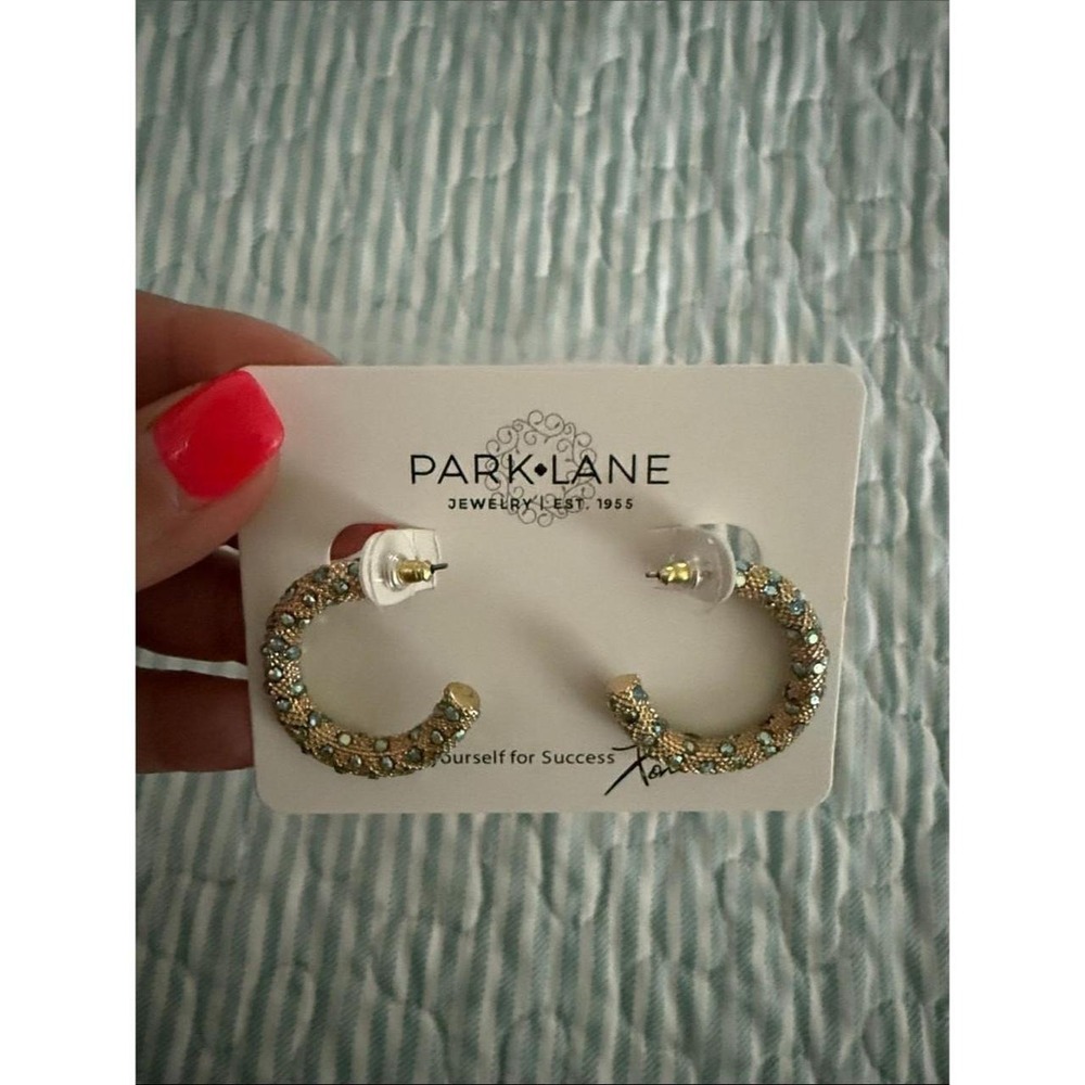 Gold hoop earring with green pave